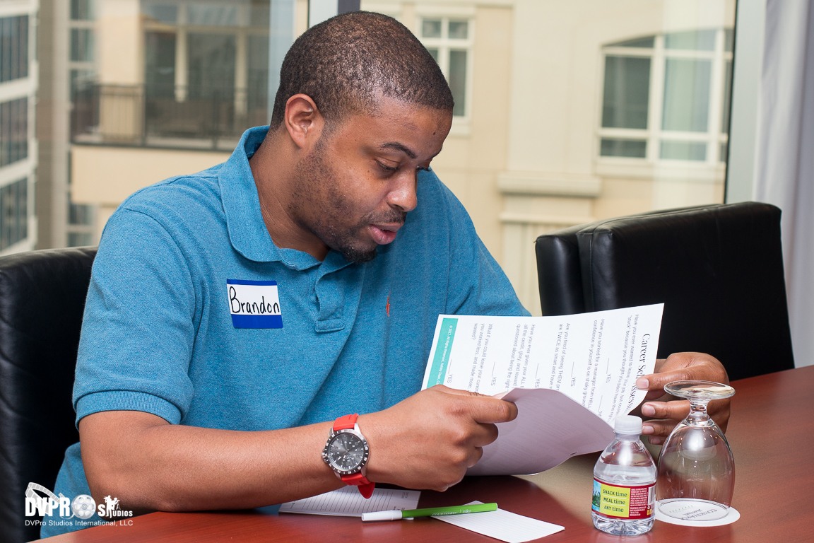 Workshop participant reflecting on printed career development materials